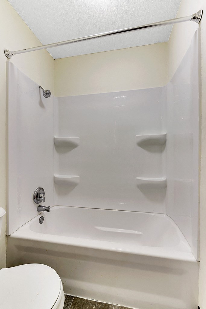 a small bathroom with a shower and a toilet