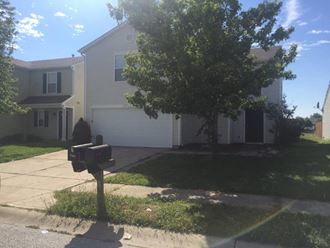 a house with a parking meter in front of it