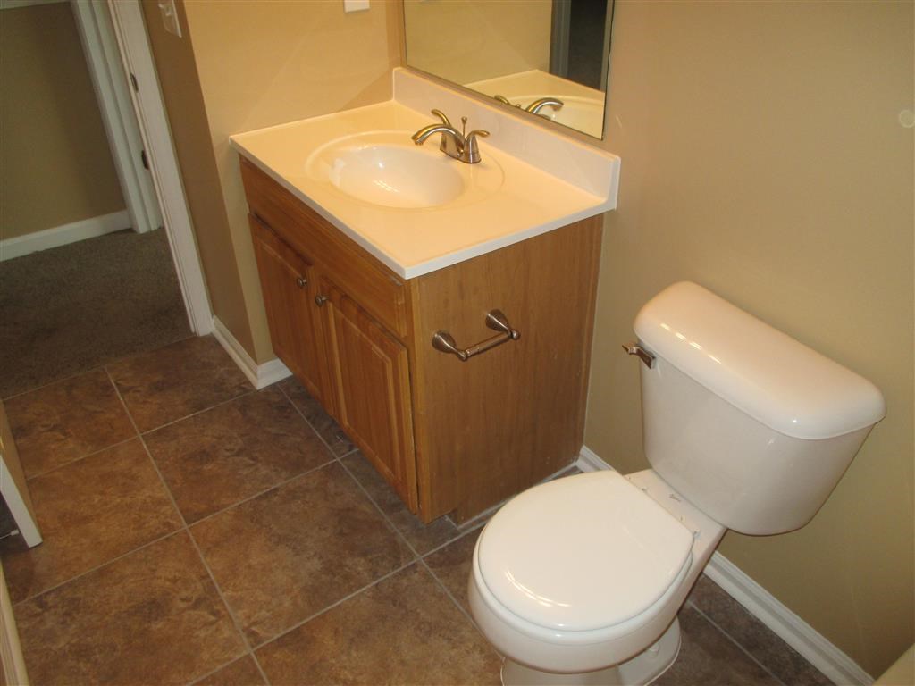 a bathroom with a toilet and a sink