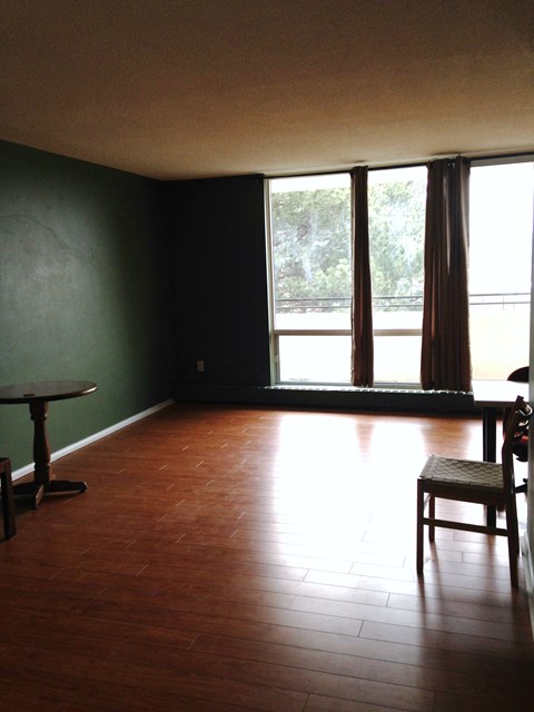 A room with a table and a chair.