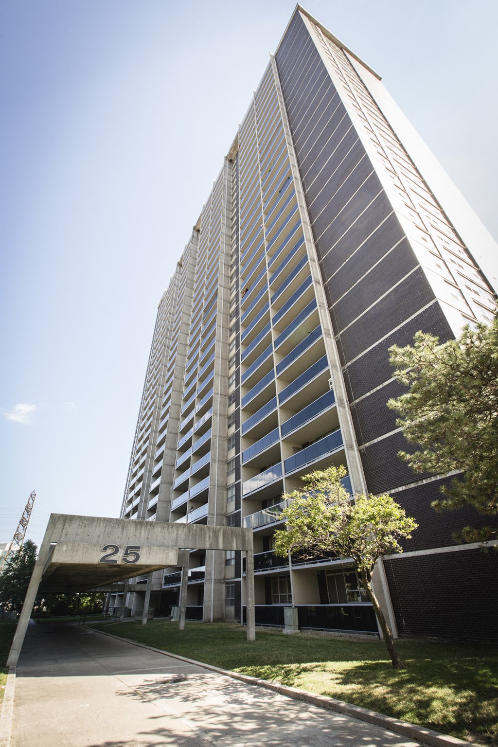 a tall building with a sign in front of it