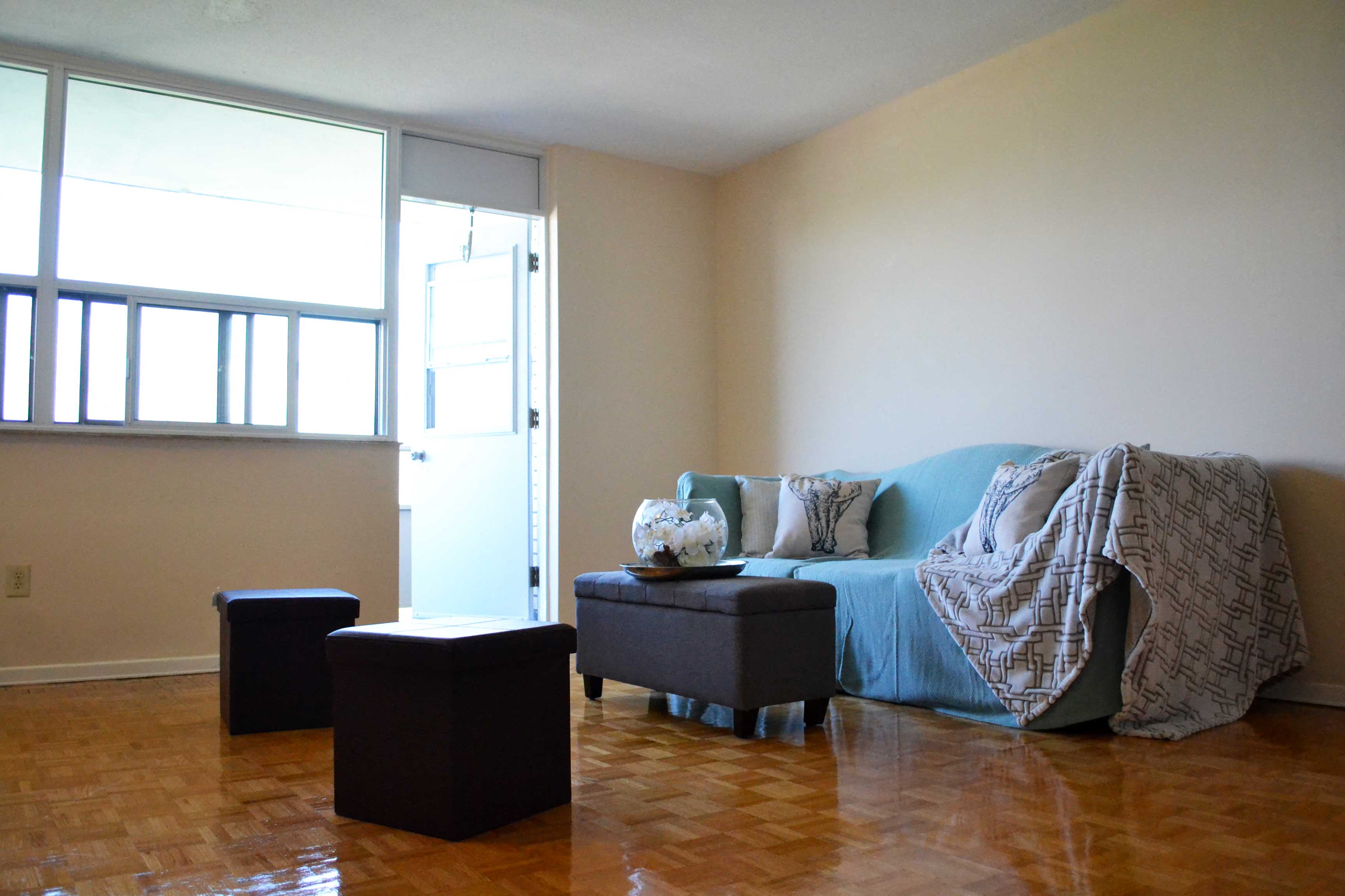 a living room with a couch and a window