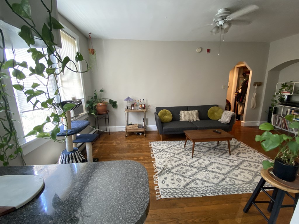 a living room with a couch and a dining room table