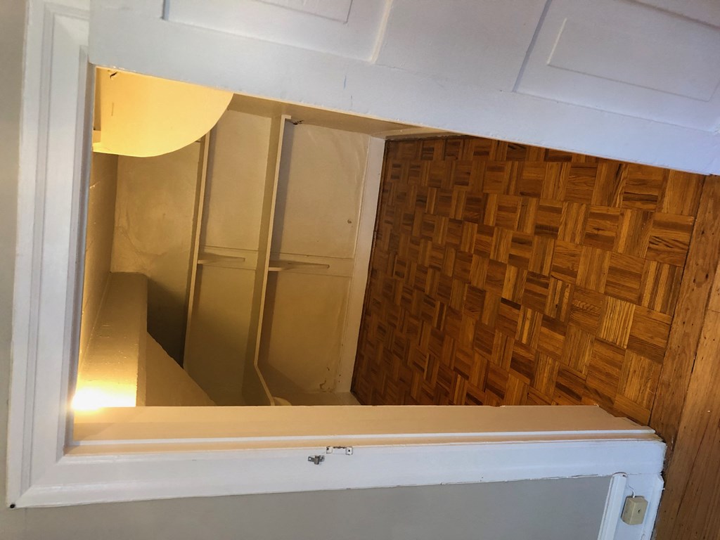 the mirror in the closet has been removed and the door is open