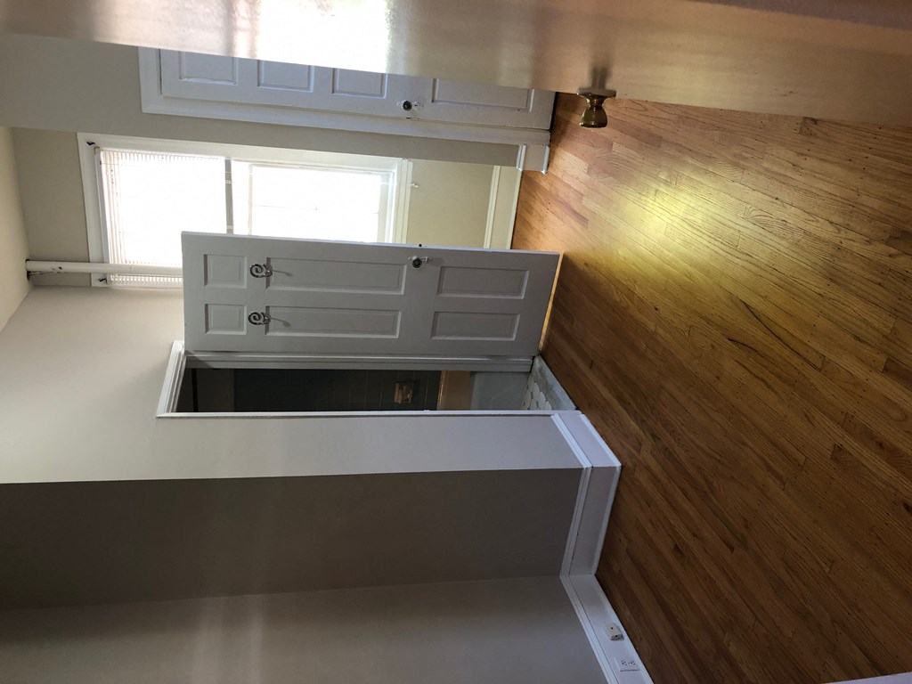 a kitchen with an island in the middle of a floor