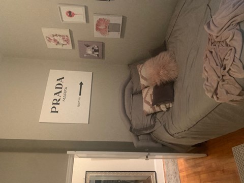 a bed with a blanket and pillows on top of it