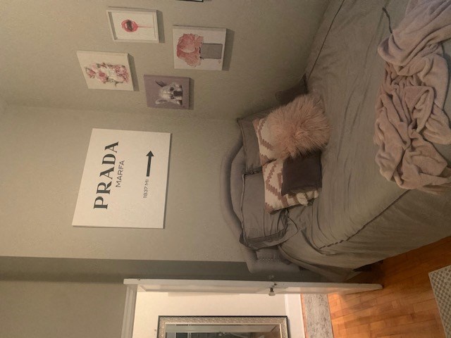 a bed with a blanket and pillows on top of it