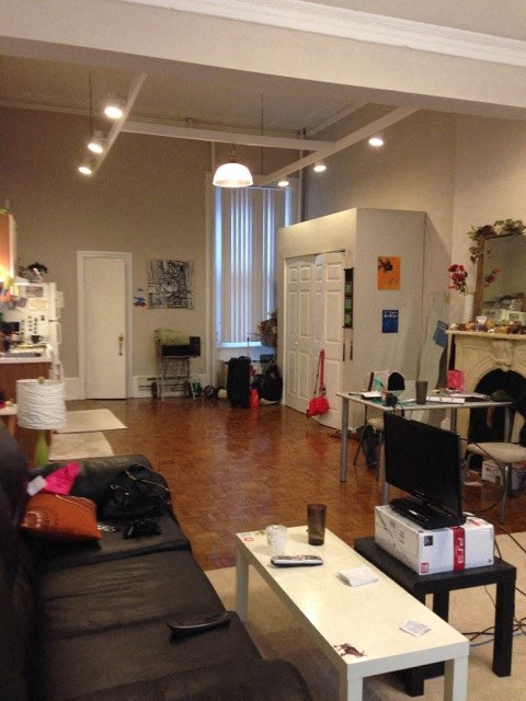 a living room with a couch and a tv