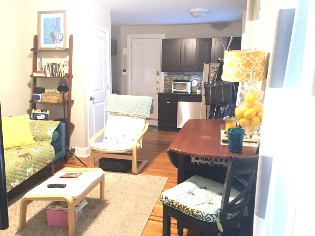 a living room with a dining room and a kitchen