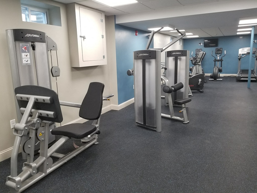 a gym with various exercise machines and weights