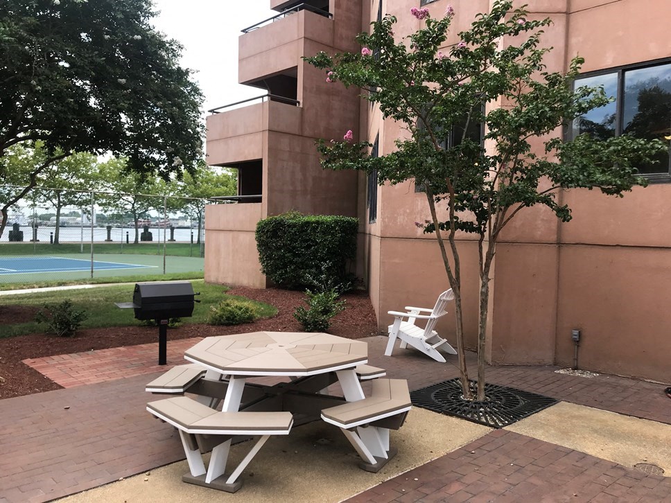 a group of benches sitting outside of an office building