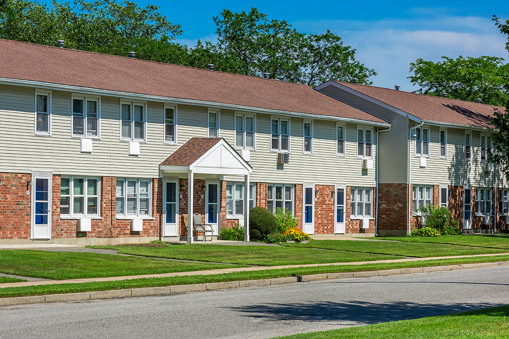 a row of houses on the side of a street