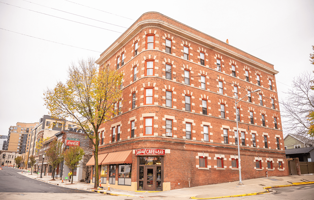 A red brick building with a sign that says "Pam's Celebration" on the front.
