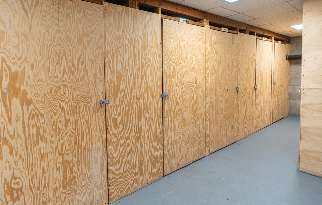 A row of wooden lockers in a room.