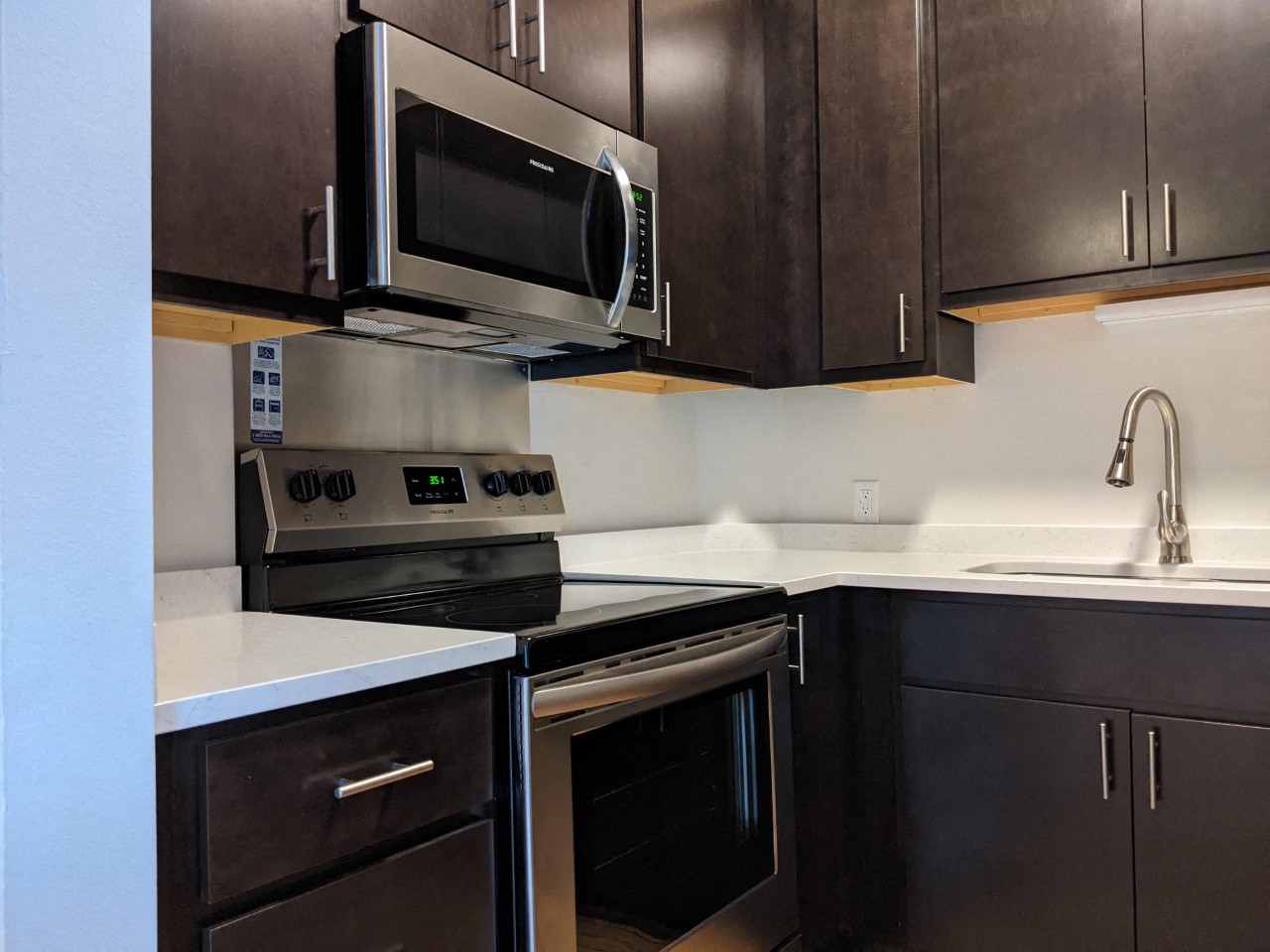a kitchen with a stove and a microwave