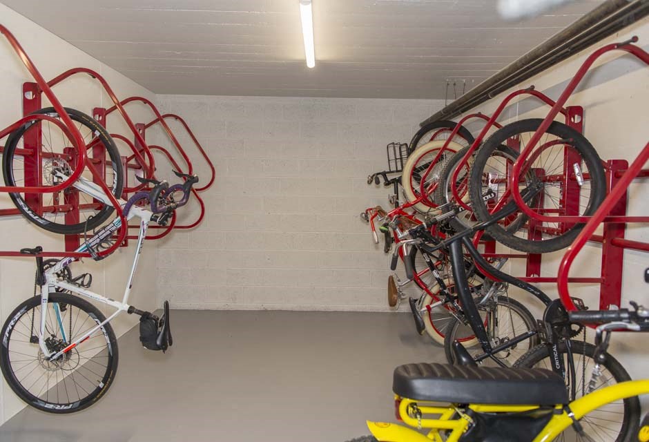 a bike shop with many bikes hanging on the wall