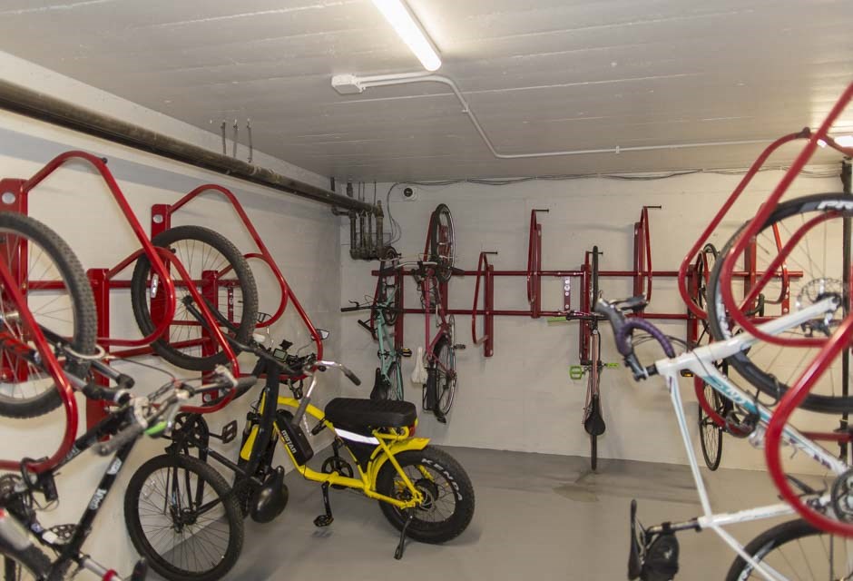 a bike shop with many bikes hanging on the wall