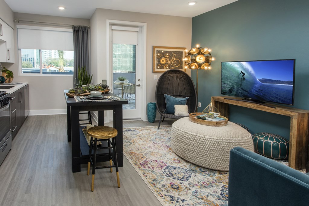 a living room with a tv and a table and a couch