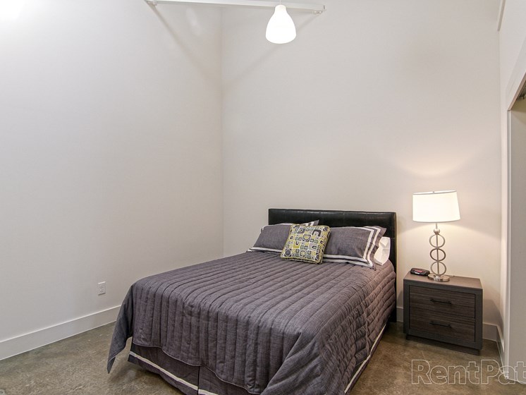Loft bedroom with high ceilings and skylight