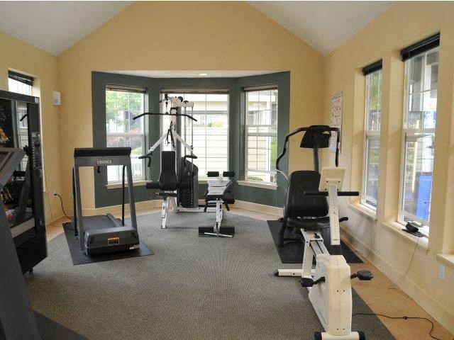 a gym with weights and other equipment in it