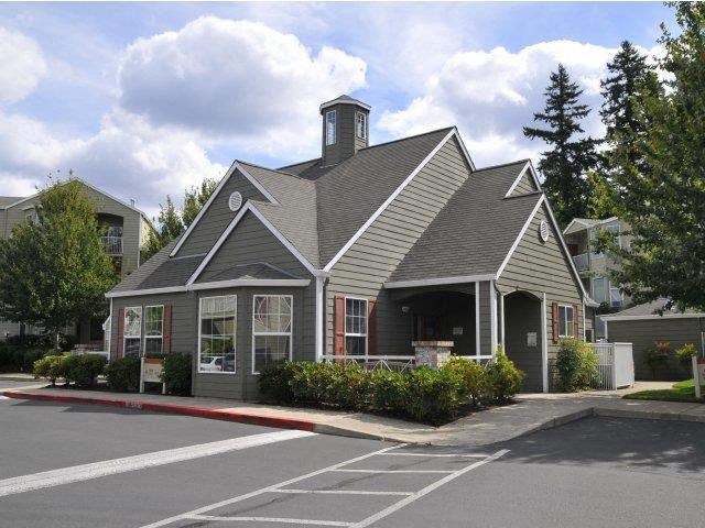 a house with a driveway and a parking lot