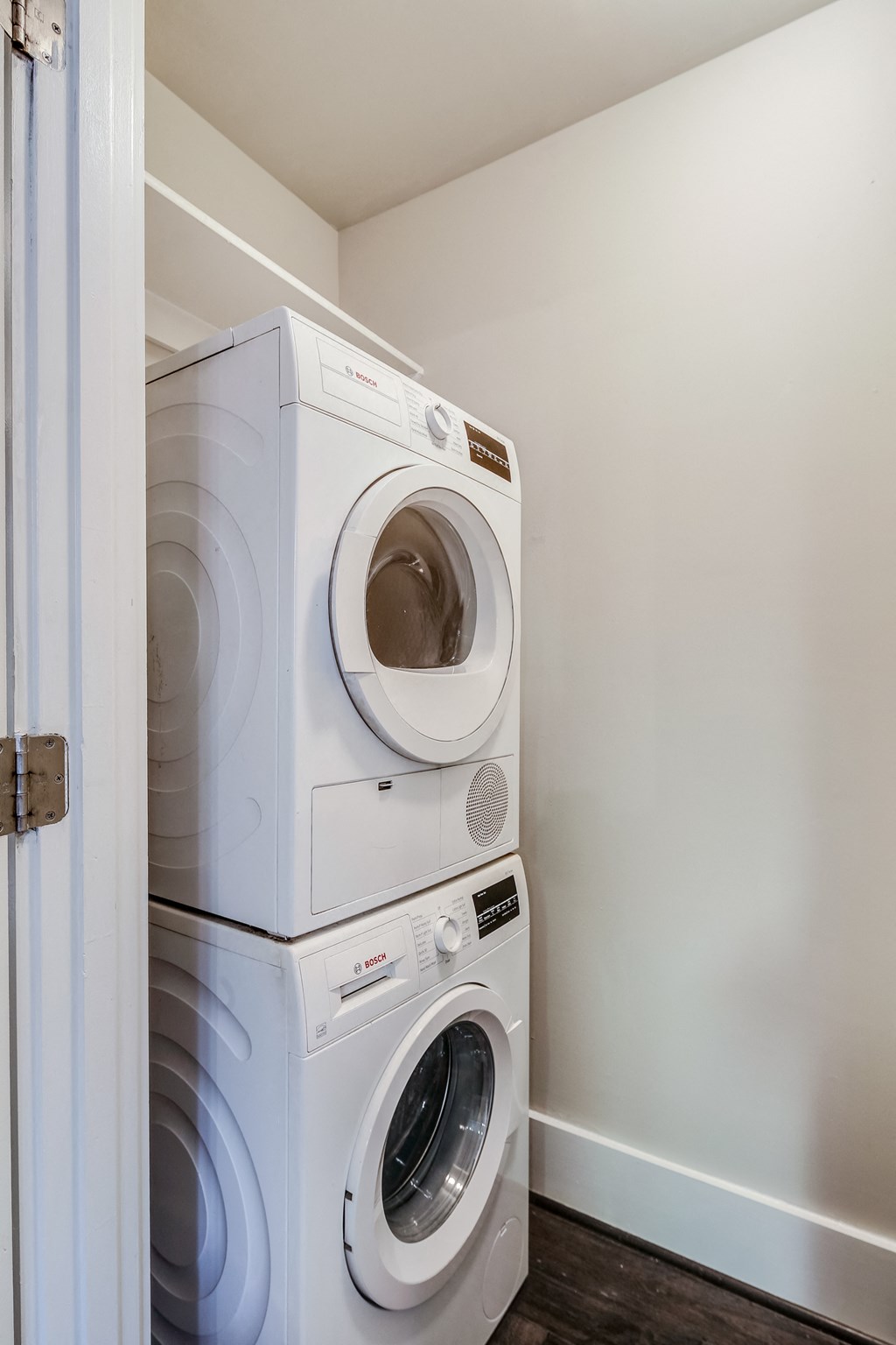 a washer and dryer in a laundry room with a door