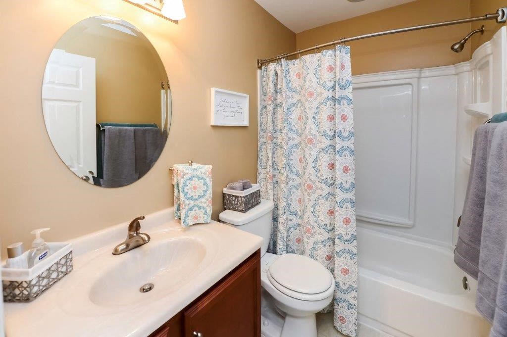 a bathroom with a sink toilet and a shower