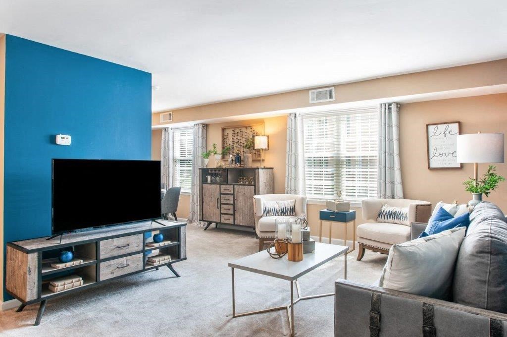 a living room with a couch and a television