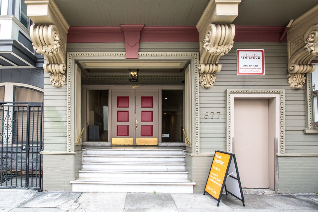 A building with a red awning and a sign that says "PENTHOUSE".