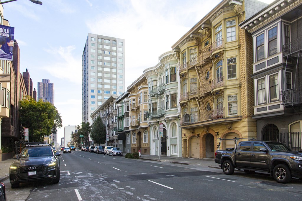 A street scene with cars and buildings.