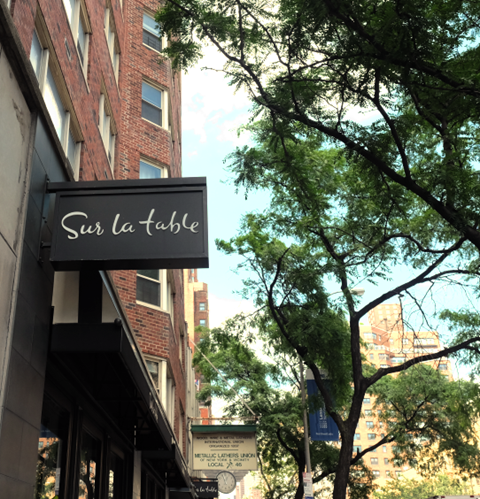 a sign for a restaurant on the side of a building