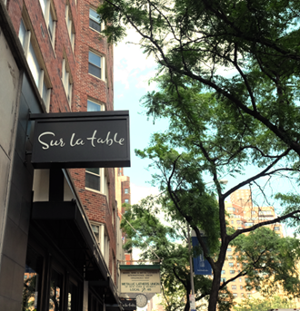 a sign for a restaurant on the side of a building