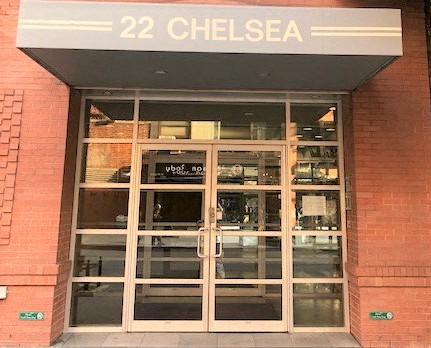 the front of a store with a glass door