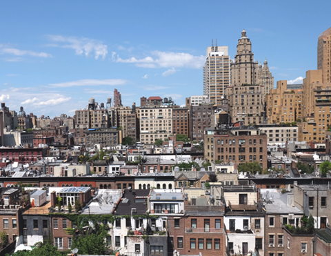 the view of the city from the roof of a building