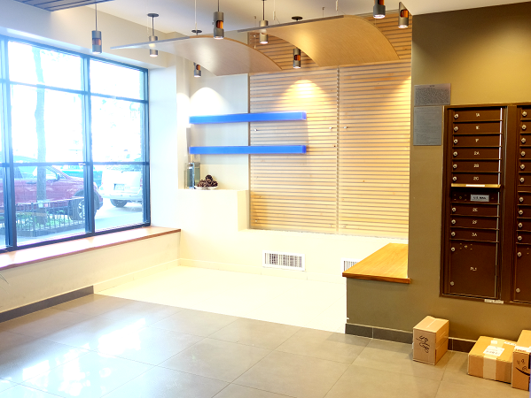 a large room with boxes on the floor and a window