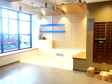 a large room with boxes on the floor and a window