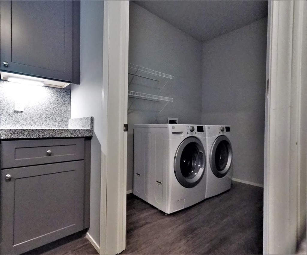 a laundry room with a washing machine and a dryer