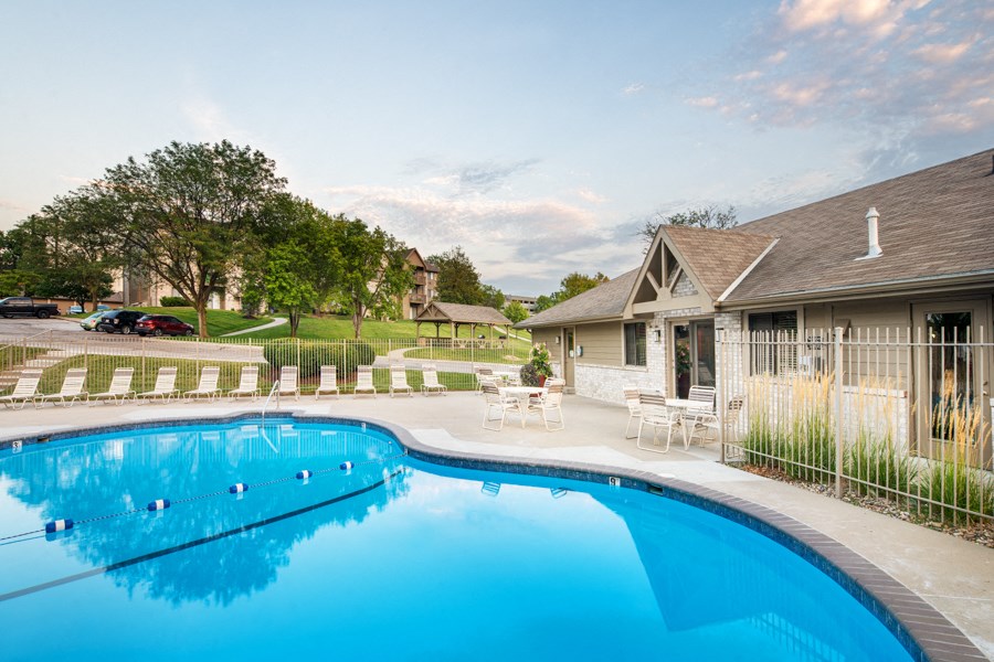 a swimming pool in front of a house