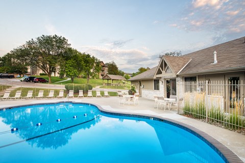 a swimming pool in front of a house