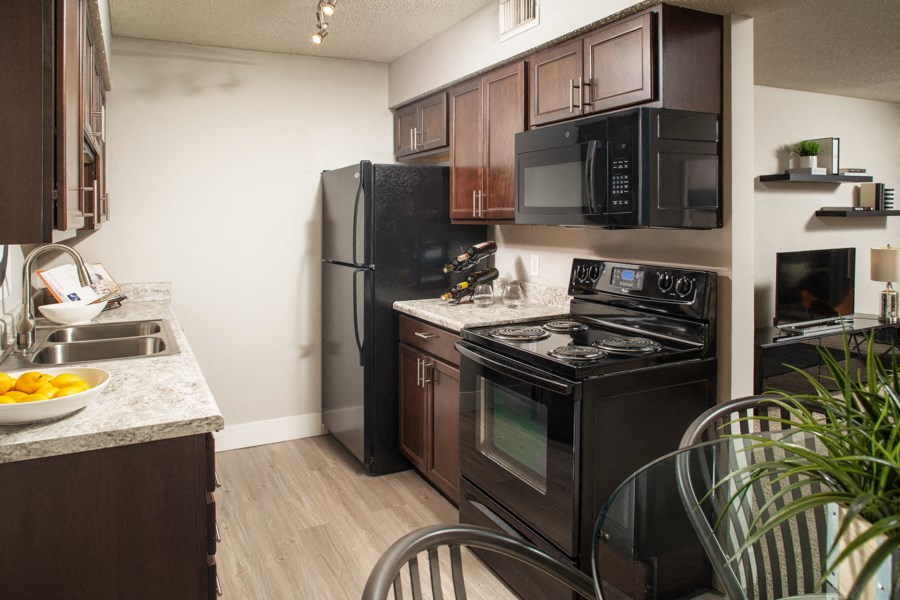 kitchen and dining area at the district at highland village apartments