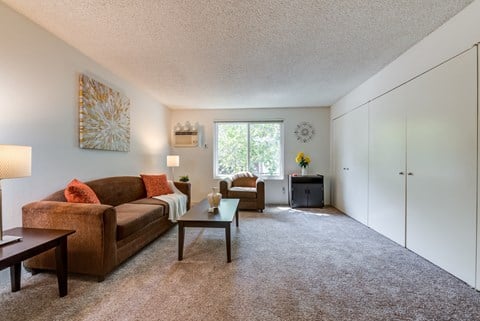 a living room with a couch and a table