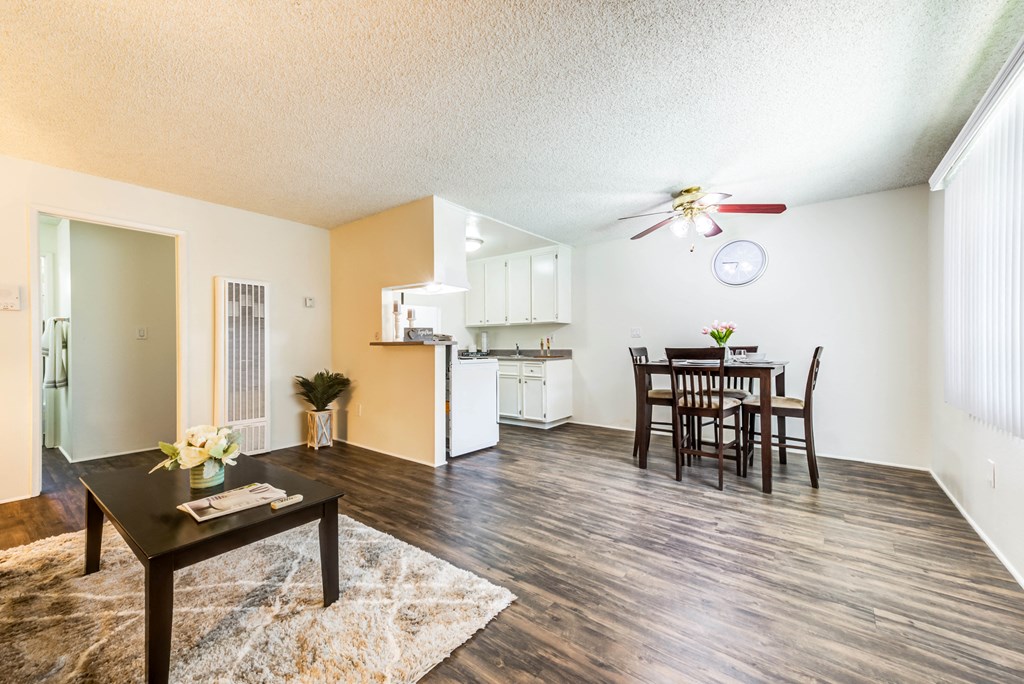 a living room with a dining room and a kitchen