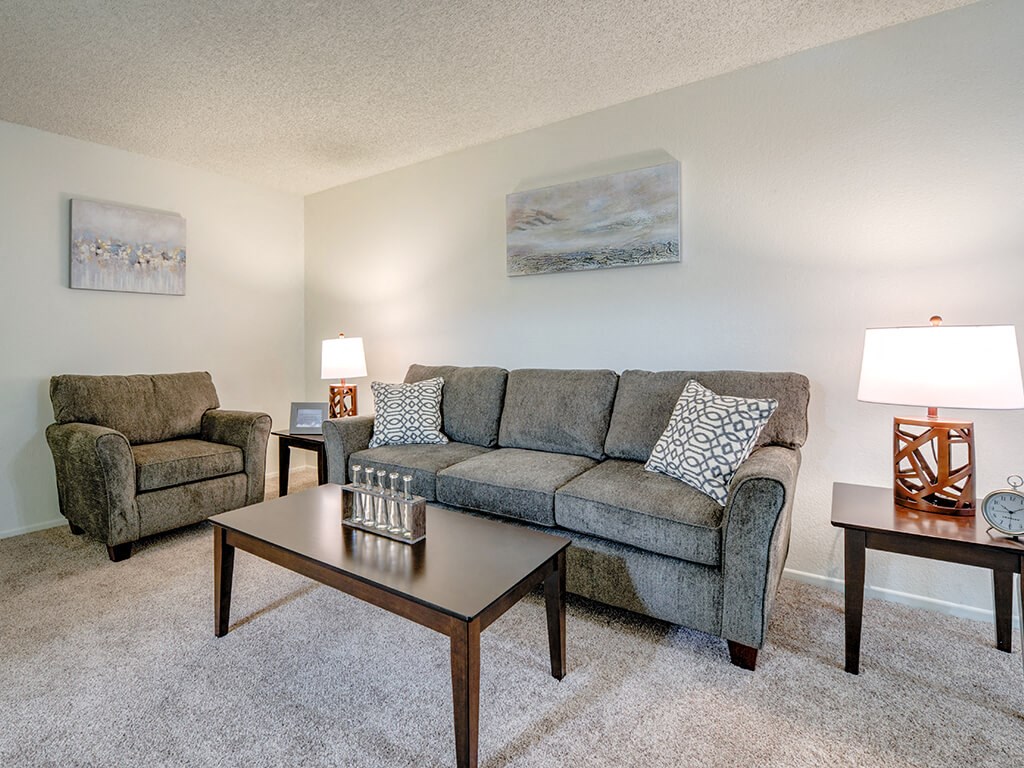 a living room with a couch and a coffee table