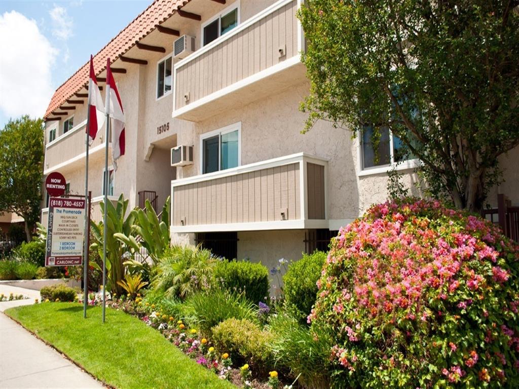Exterior image with beautifully manicured landscaping at the Promenade Apartment in Van Nuys, CA