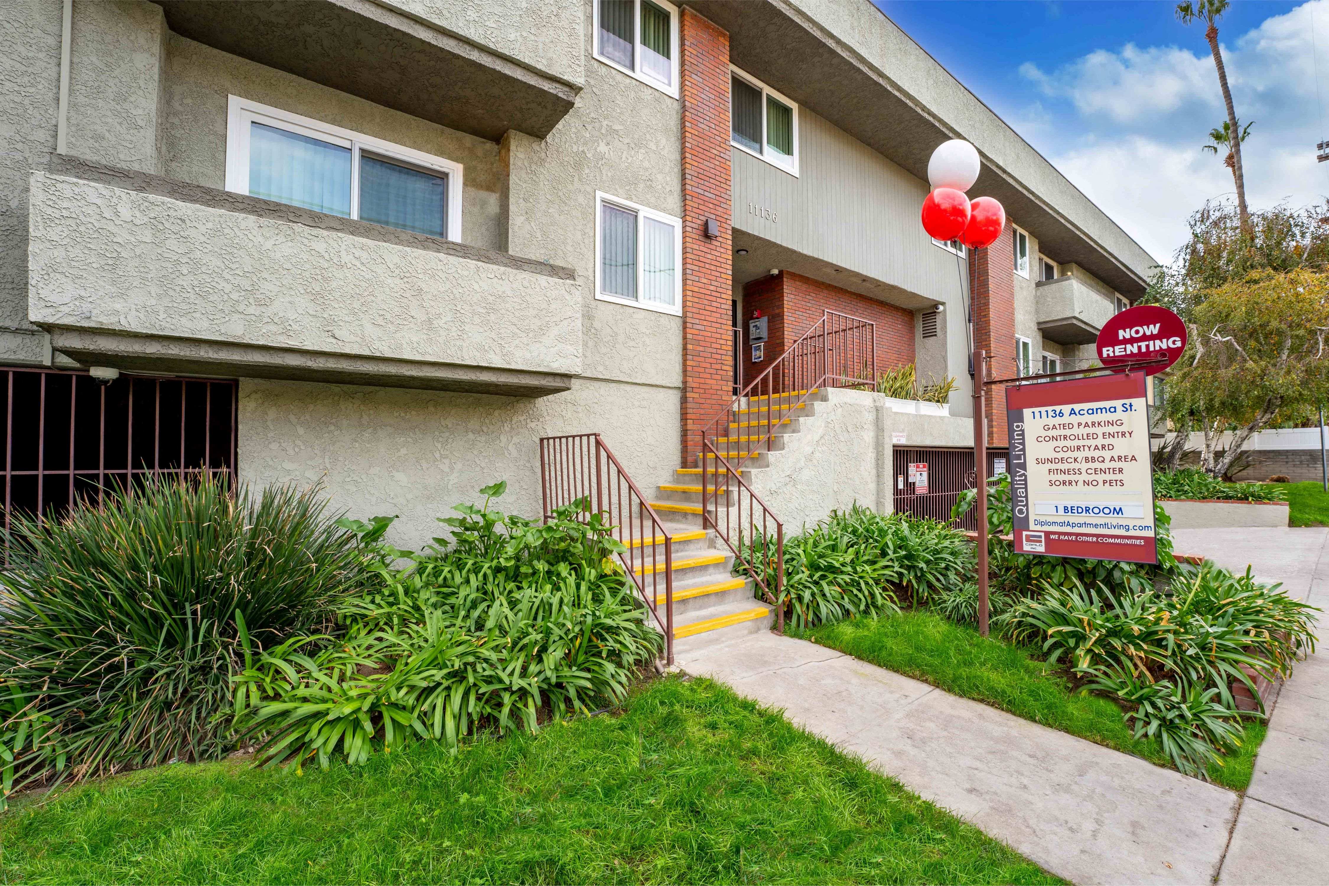 Exterior image with beautifully manicured landscaping at the Diplomat Apartment in Sherman Oaks, CA
