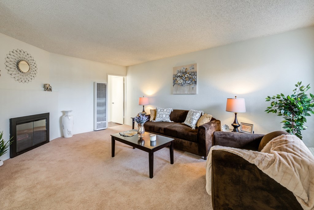 a living room with a fireplace and a couch