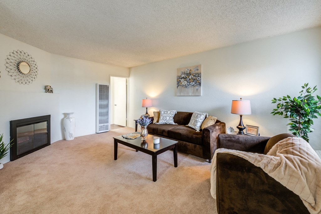 a living room with a fireplace and a couch