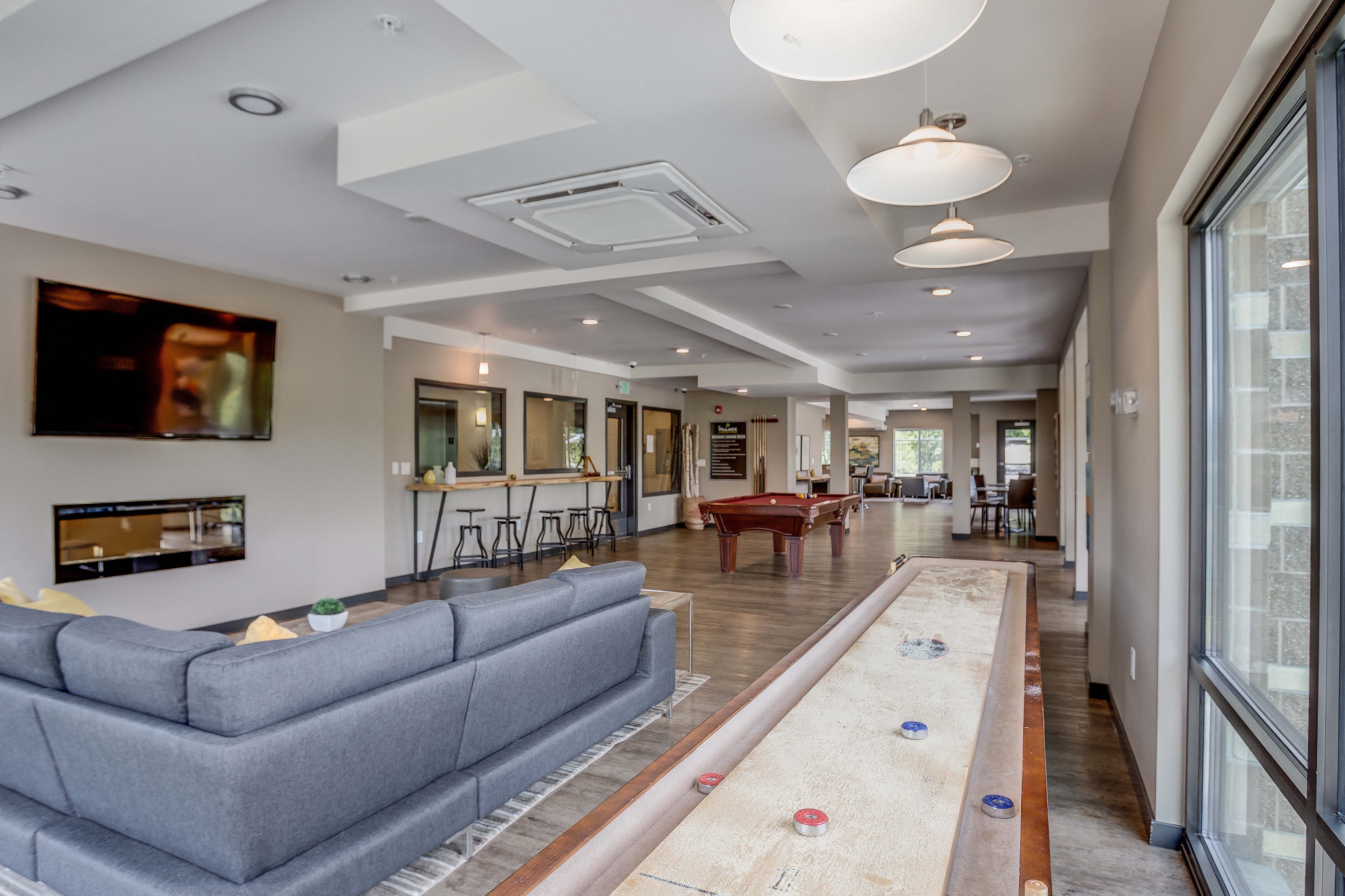 a long living room with a couch and a table