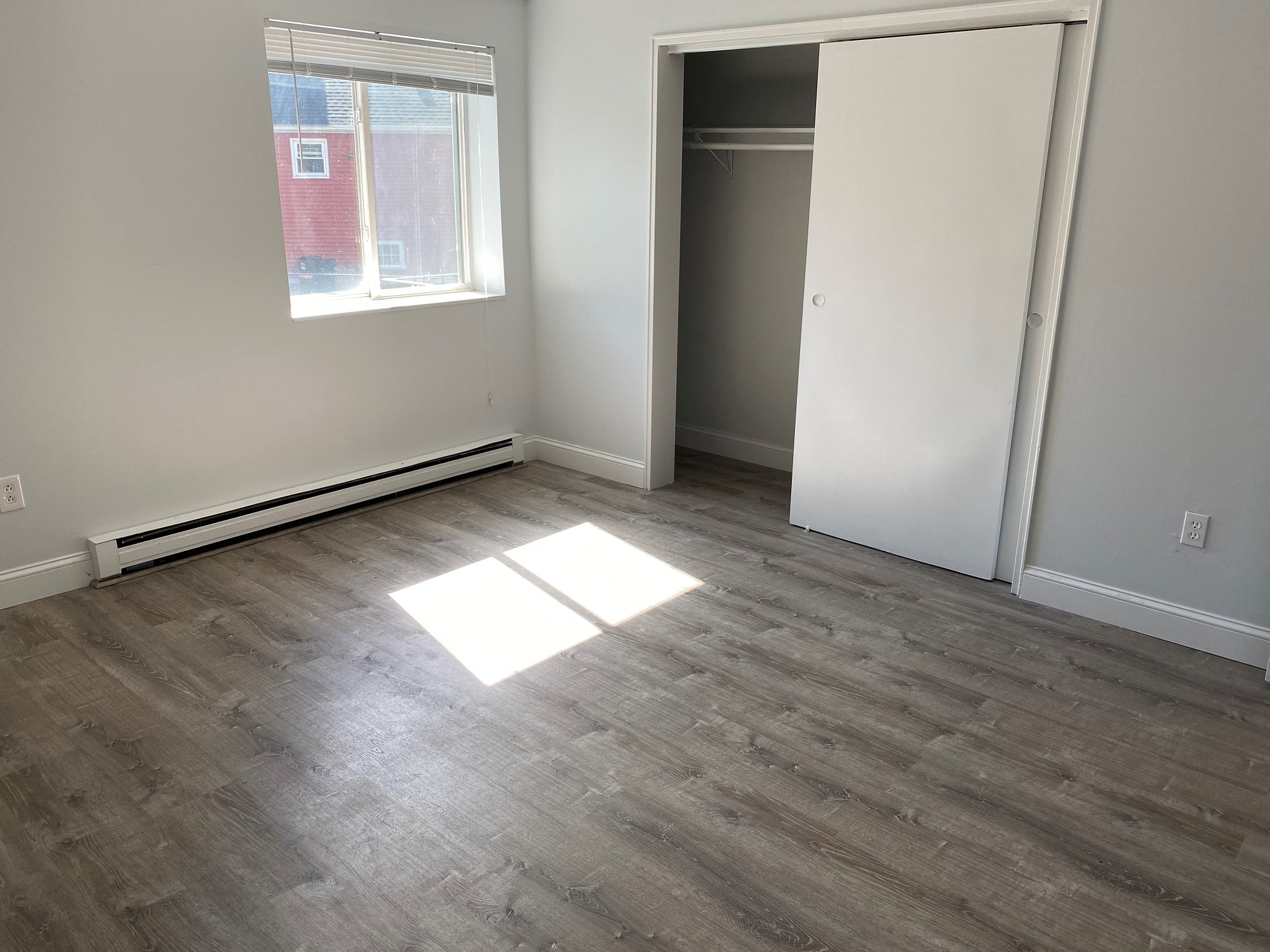 Bedroom with laminate flooring