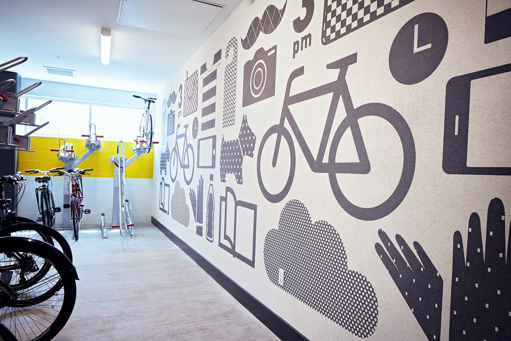a wall with bicycle logos on it in a bike shop